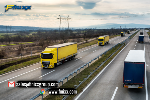 Yellow trucks driving on a highway representing Finixx truck tires for efficient and reliable transport solutions.