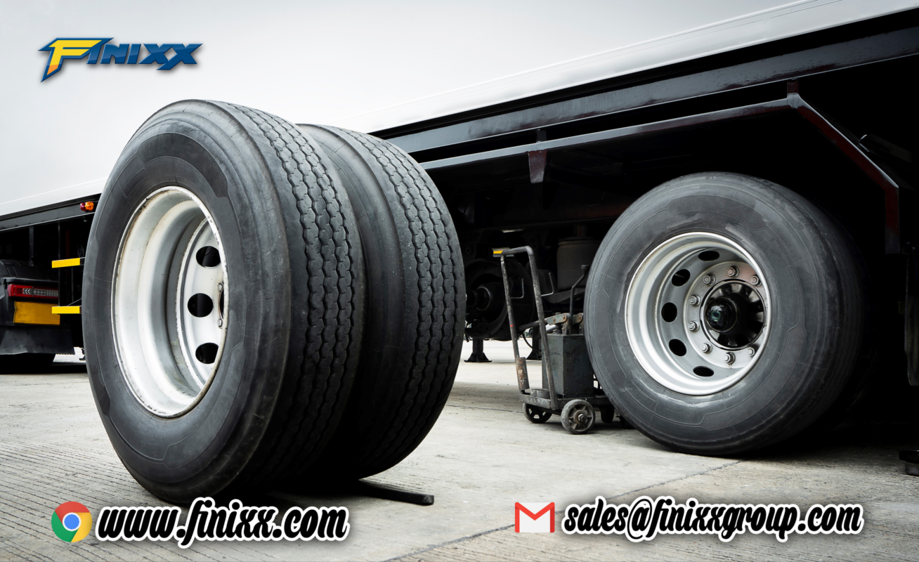 Close-up of truck trailer tires with Finixx branding, highlighting the durability and performance of Finixx OTR and TBR tires for commercial use.