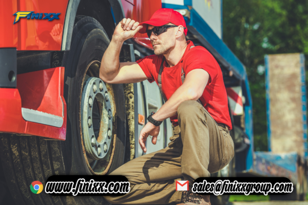 Truck driver inspecting tire before setting off on the road, highlighting Finixx Truck Tires logo with contact details and website link