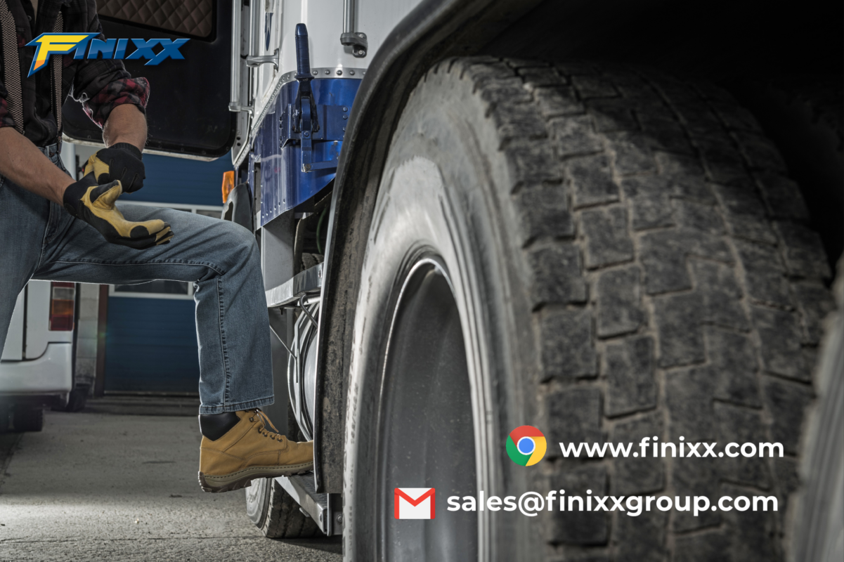 Truck driver preparing to inspect truck tires for maintenance with Finixx truck tire in focusTruck driver preparing to inspect truck tires for maintenance with Finixx truck tire in focus