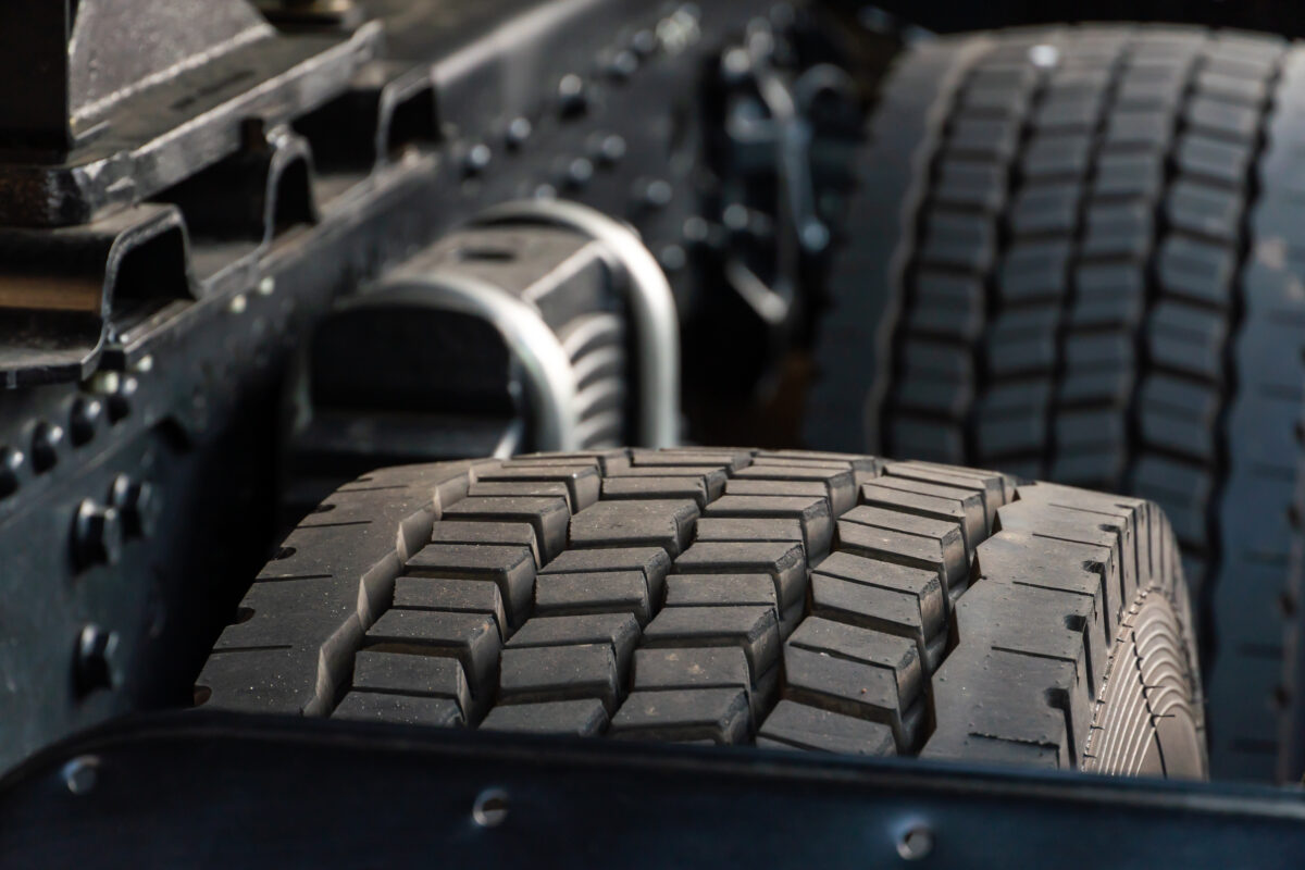 Heavy-duty OTR tires on a construction vehicle in a rugged mining site